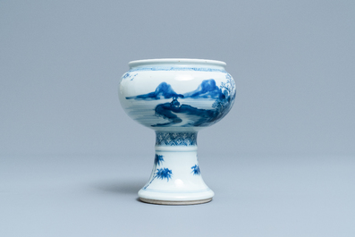 A Chinese blue and white stem cup with a continuous landscape scene, Kangxi/Yongzheng