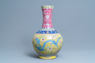 A large Chinese yellow-ground famille rose 'dragon and phoenix' bottle vase, 19th C.