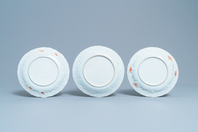 Three Chinese iron red and gilt 'milk and blood' plates, Kangxi