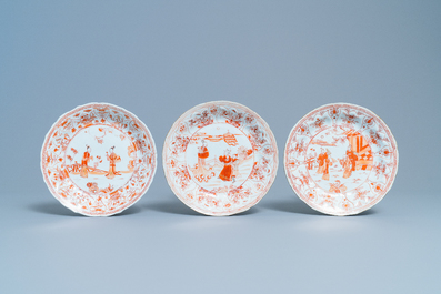 Three Chinese iron red and gilt 'milk and blood' plates, Kangxi