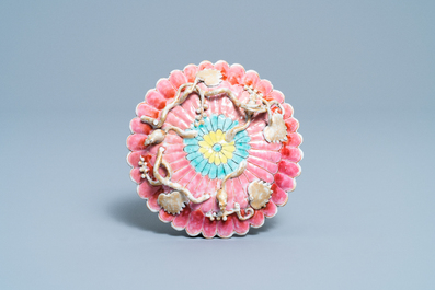 A Chinese famille rose cup and saucer and a 'magnolia' cup, Yongzheng
