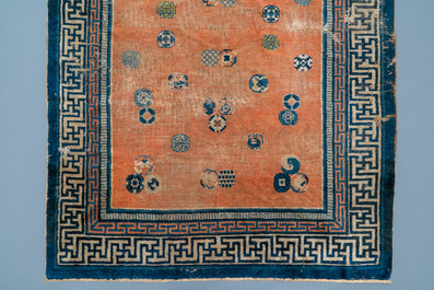 A rectangular Chinese hand-knotted wool carpet with brocade balls, 19th C.