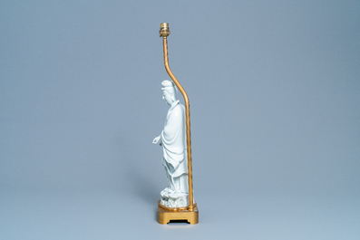 A Chinese gilt bronze lamp-mounted blanc de Chine figure of Guanyin, 19/20th C.