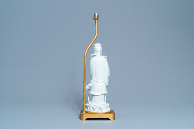 A Chinese gilt bronze lamp-mounted blanc de Chine figure of Guanyin, 19/20th C.