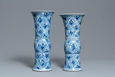 A large Chinese blue and white five-piece garniture with floral and landscape panels, Kangxi