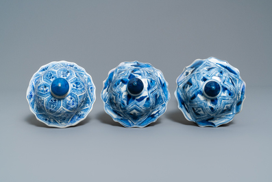 A large Chinese blue and white five-piece garniture with floral and landscape panels, Kangxi