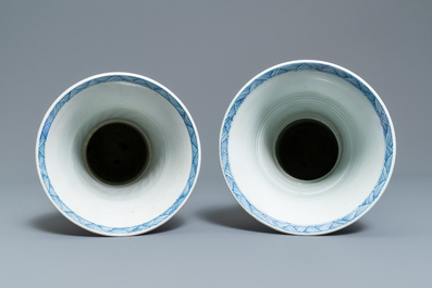 A large Chinese blue and white five-piece garniture with floral and landscape panels, Kangxi