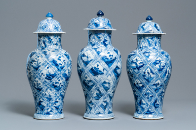 A large Chinese blue and white five-piece garniture with floral and landscape panels, Kangxi
