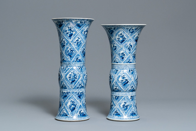 A large Chinese blue and white five-piece garniture with floral and landscape panels, Kangxi