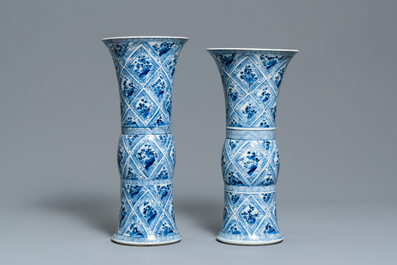 A large Chinese blue and white five-piece garniture with floral and landscape panels, Kangxi