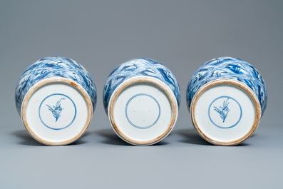 A large Chinese blue and white five-piece garniture with floral and landscape panels, Kangxi