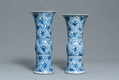 A large Chinese blue and white five-piece garniture with floral and landscape panels, Kangxi