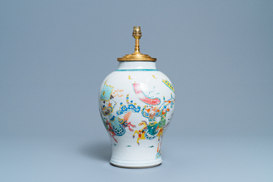 A Chinese gilt bronze lamp-mounted famille rose 'warrior' vase, 19/20th C.