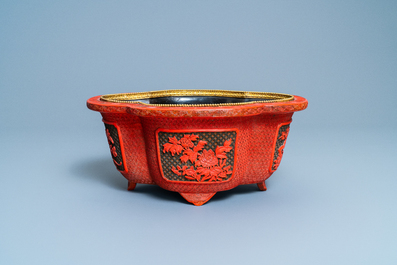 A Chinese quatrefoil jardini&egrave;re in red and black lacquer, Qianlong