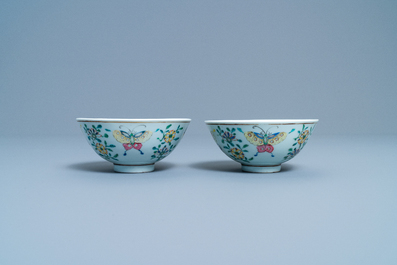 A pair of Chinese famille rose rice grain pattern 'butterfly' bowls, Qianlong mark, 18/19th C.