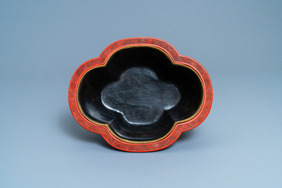 A Chinese quatrefoil jardini&egrave;re in red and black lacquer, Qianlong