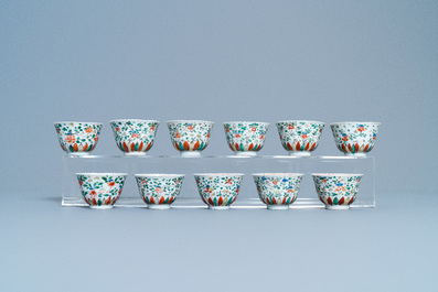 Eleven Chinese famille verte cups and thirteen saucers, Kangxi