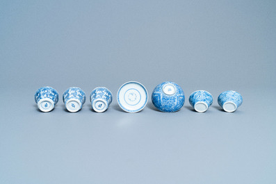 A varied collection of Chinese blue and white cups and saucers, Kangxi