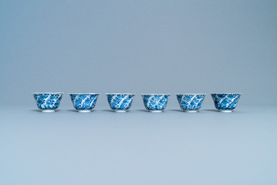 A varied collection of Chinese blue and white cups and saucers, Kangxi