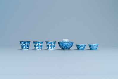A varied collection of Chinese blue and white cups and saucers, Kangxi