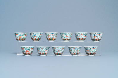 Eleven Chinese famille verte cups and thirteen saucers, Kangxi