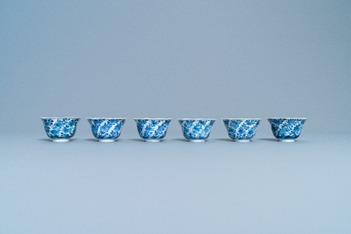 A varied collection of Chinese blue and white cups and saucers, Kangxi