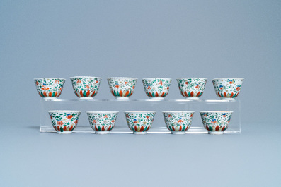 Eleven Chinese famille verte cups and thirteen saucers, Kangxi