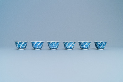 A varied collection of Chinese blue and white cups and saucers, Kangxi
