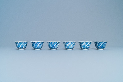 A varied collection of Chinese blue and white cups and saucers, Kangxi