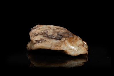 A Chinese mottled white jade mountain landscape with a fishing boat, Qing