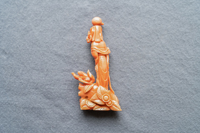 A Chinese carved red coral group of a lady, a squirrel and a rabbit, 19/20th C.
