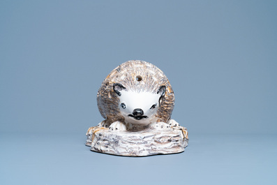 A polychrome faience flower holder shaped as a hedgehog, Northern France, 18/19th C.