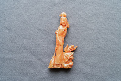 A Chinese carved red coral group of a lady, a squirrel and a rabbit, 19/20th C.