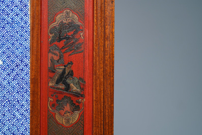 A large Chinese famille rose plaque in a lacquered wooden frame, 19th C.
