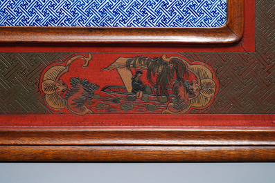 A large Chinese famille rose plaque in a lacquered wooden frame, 19th C.