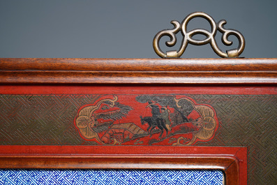 A large Chinese famille rose plaque in a lacquered wooden frame, 19th C.