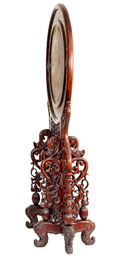 A massive Chinese carved wooden screen with a round famille verte plaque and polychrome lacquer, 19th C.