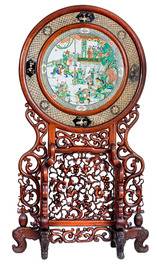 A massive Chinese carved wooden screen with a round famille verte plaque and polychrome lacquer, 19th C.