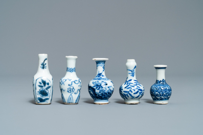 Fifteen Chinese mostly blue and white miniature vases, Kangxi