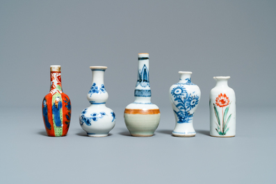Fifteen Chinese mostly blue and white miniature vases, Kangxi