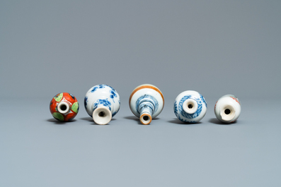 Fifteen Chinese mostly blue and white miniature vases, Kangxi
