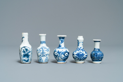 Fifteen Chinese mostly blue and white miniature vases, Kangxi