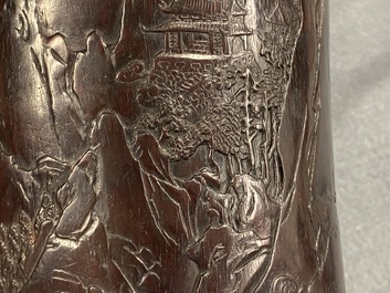 A Chinese carved zitan wood brush pot with a mountainous landscape, 17/18th C.