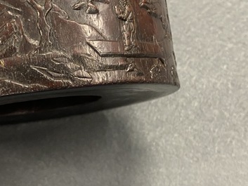A Chinese carved zitan wood brush pot with a mountainous landscape, 17/18th C.