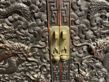 Un petit cabinet en bois sculpt&eacute; &agrave; d&eacute;cor de dragons, Chine, R&eacute;publique