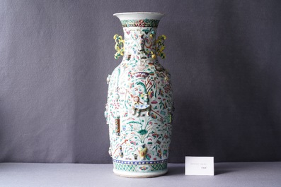 A Chinese relief-moulded famille rose 'antiquities' vase, 19th C.