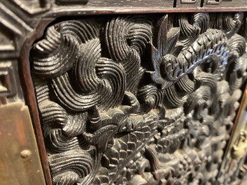 Un petit cabinet en bois sculpt&eacute; &agrave; d&eacute;cor de dragons, Chine, R&eacute;publique