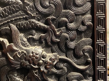 Un petit cabinet en bois sculpt&eacute; &agrave; d&eacute;cor de dragons, Chine, R&eacute;publique