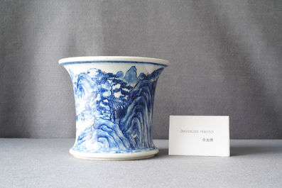 A fine Chinese blue, white and copper red 'Master of the Rocks' brush pot, Kangxi