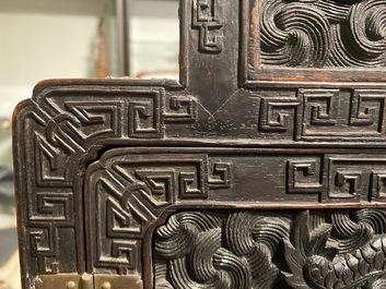 Un petit cabinet en bois sculpt&eacute; &agrave; d&eacute;cor de dragons, Chine, R&eacute;publique